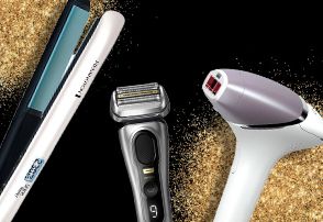 Remington, Oral-B and Philips products surrounded by gold glitter on a black background